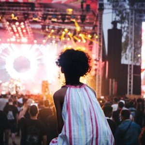 Vibrant outdoor music festival in Casablanca, Morocco with a lively crowd and colorful stage lights.
